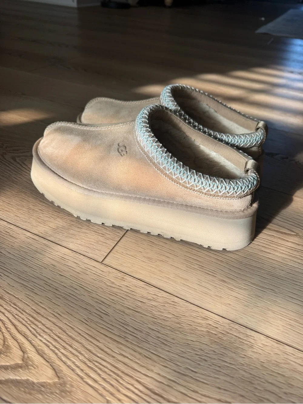 UGG women’s Slip-On Suede Slippers in Light Brown with Blue Trim
